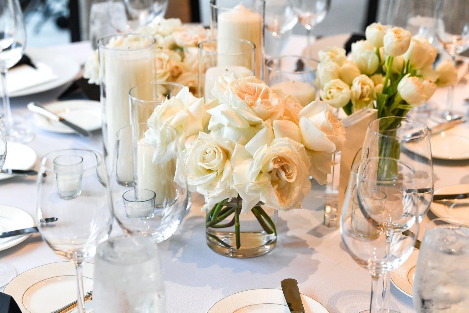 Ivory rose and candlelight reception tablescape
