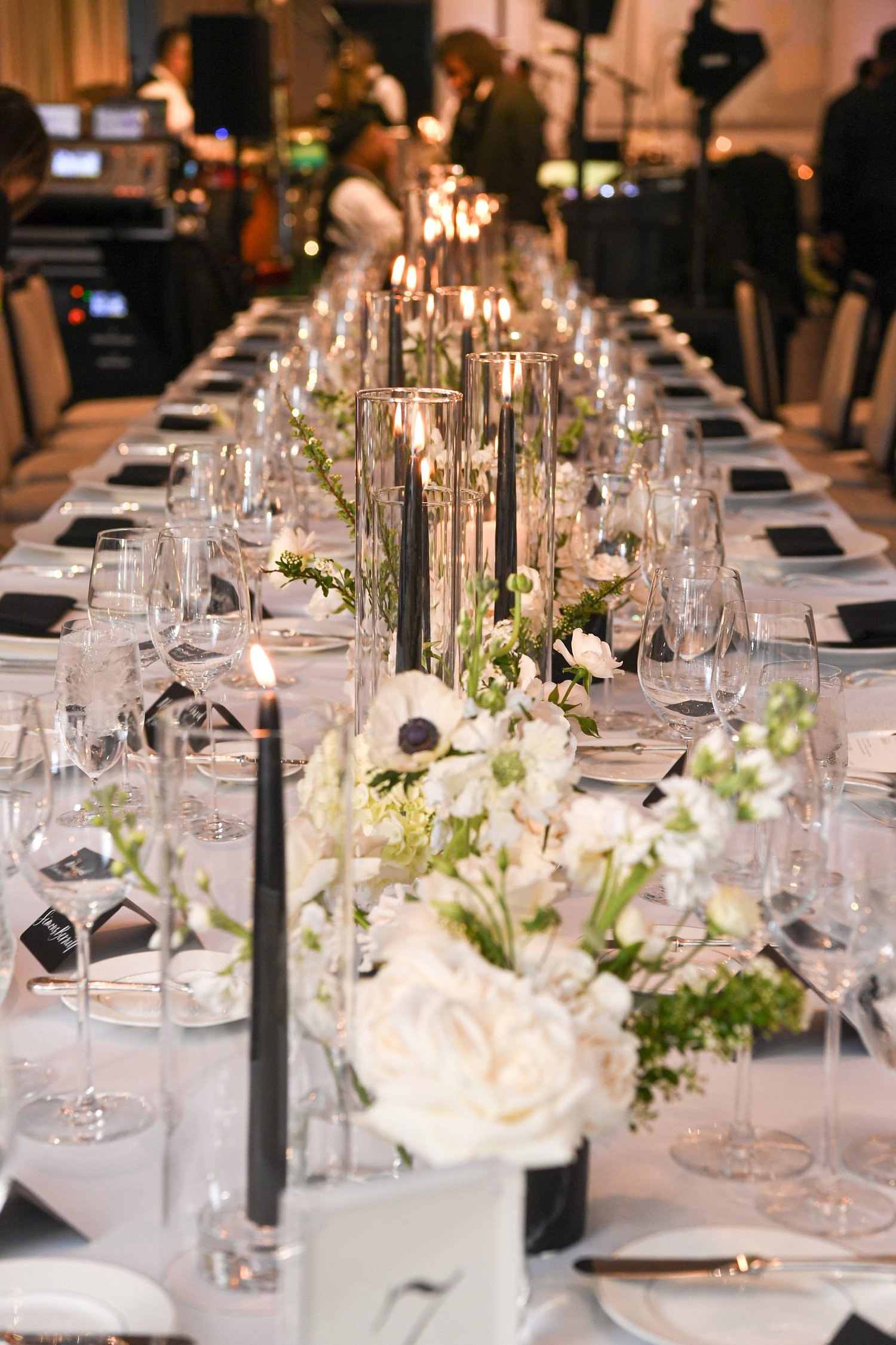 Long reception table with tapers and low florals