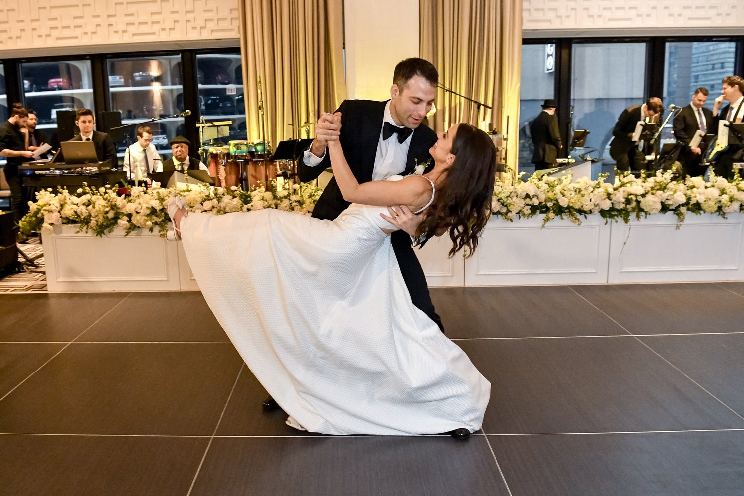 First dance beside a floral-lined head table