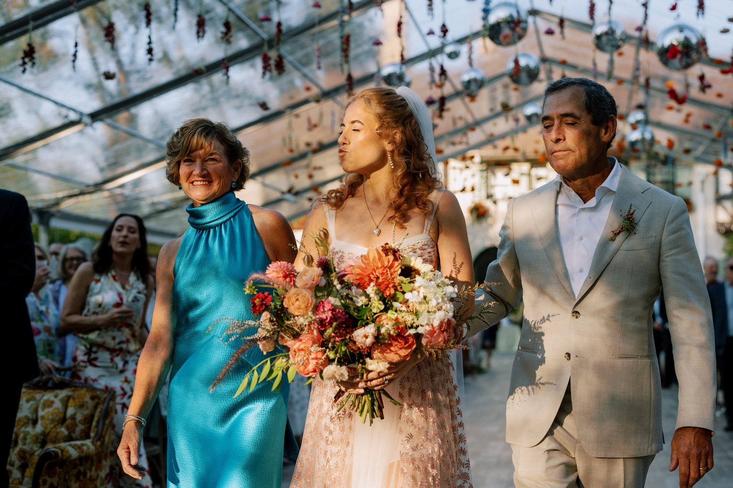 Wedding party procession with bouquets